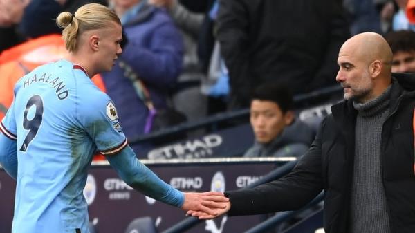 Guardiola embraces Haaland after his hat-trick against Wolves