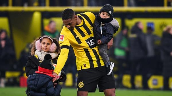 Sebastien Haller celebrates Dortmund's victory with his children