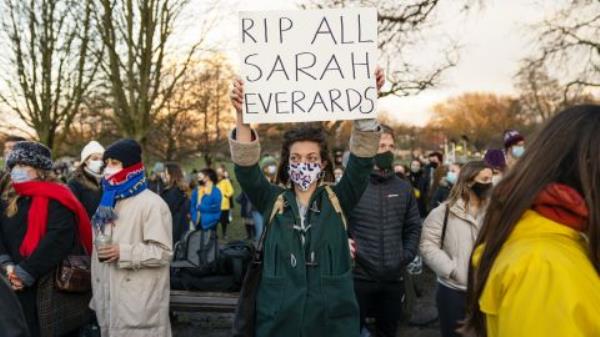 A demo<em></em>nstrator holds a placard at the vigil for Sarah Everard.