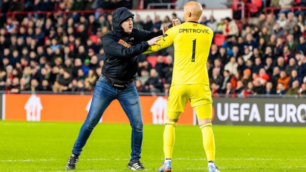 Sevilla goalkeeper Marko Dmitrovic was attacked by a pitch invader