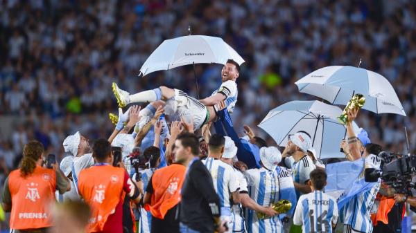 Lio<em></em>nel Messi is hoisted aloft by his Argentina teammates as they celebrate the World Cup win.