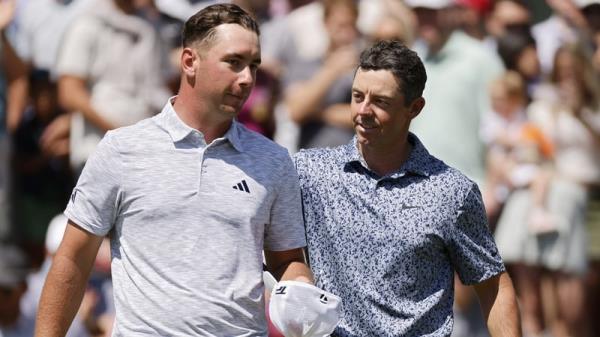 Lucas Herbert (L) with Rory McIlroy