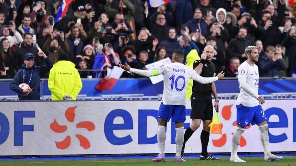 Kylian Mbappe celebrates with French fans after scoring the fourth goal against the Dutch