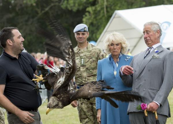 Charles and Camilla leave a charity event together in July 2002.