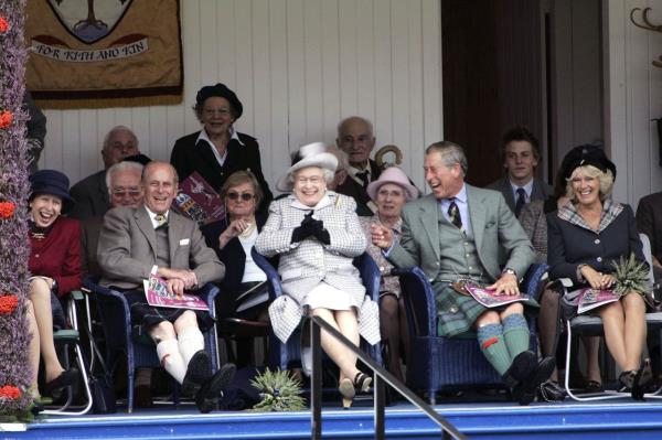 Prince Louis holds his hands over his ears as jets roar over Buckingham Palace during the Trooping the Colour parade in Lo<em></em>ndon in June 2022. From left are Camilla, Charles, Queen Elizabeth II, Prince Louis, Duchess Catherine, Princess Charlotte, Prince George and Prince William.