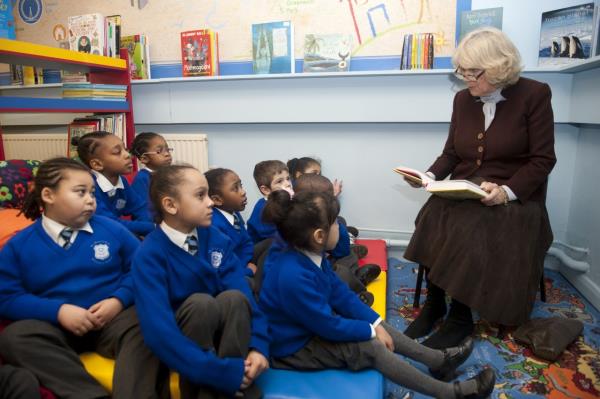 Camilla reads to primary school students in Lo<em></em>ndon in January 2012.