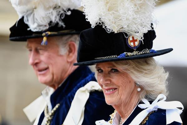 Camilla talks to Prince Charles at a polo match  in 1975.