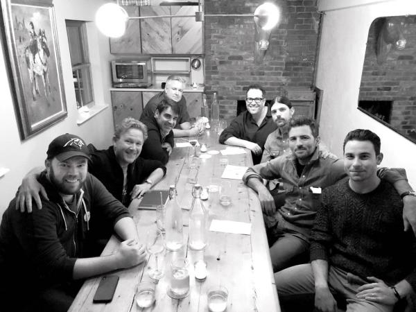 The “Swept Away” creative team at a 2018 brainstorming session in a Brooklyn. N.Y., restaurant after the first reading of the show. From left, producer Matthew Masten, playwright John Logan, The Avett Brothers bass player Bob Crawford, band manager Dolph Ramseur, director Michael Mayer, Seth Avett, Scott Avett and producer Sean Hudock.