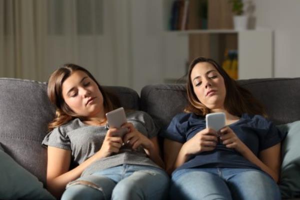 Two Bored Women on Their Phoned