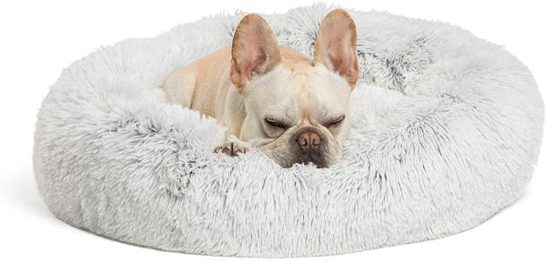 French bulldog sleeping on plush fur bed