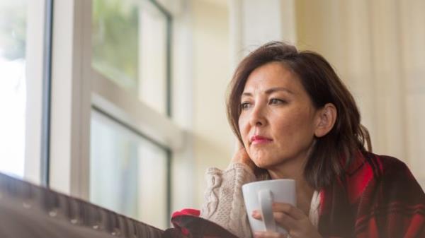 sad woman looking out to the side