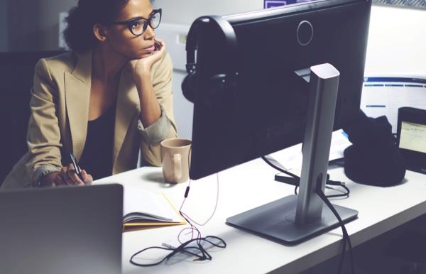 female editor sitting in newsroom U.S. state 1990s-era news stories