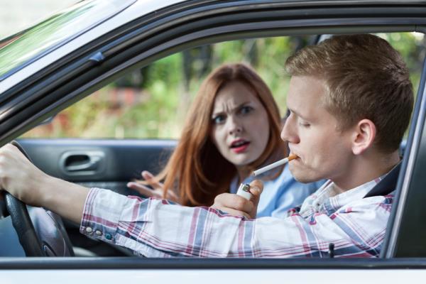 smoking man annoyed woman